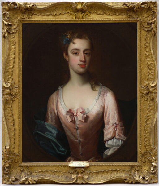 British School (early 18th century) Portrait of a Lady, half length adorned with flowers wearing a pink dress with a blue sash